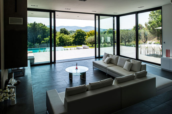 Living room with bay windows overlooking a view