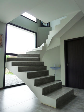 Modern stairs in front of a large window